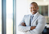 african american office worker with arms folded