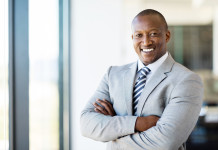 african american office worker with arms folded