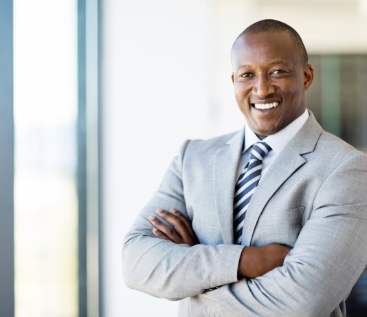 african american office worker with arms folded