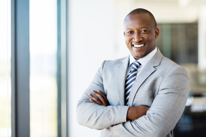 african american office worker with arms folded